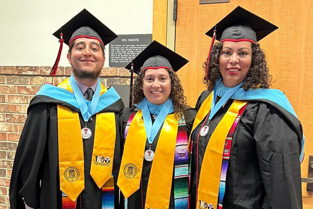 Yessica Irigoyen-Tristan, Hector Perez and Christina Reveco in graduation gowns